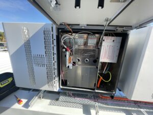 Inside a Fonius as it's being installed by one of the Sunrays Power team
