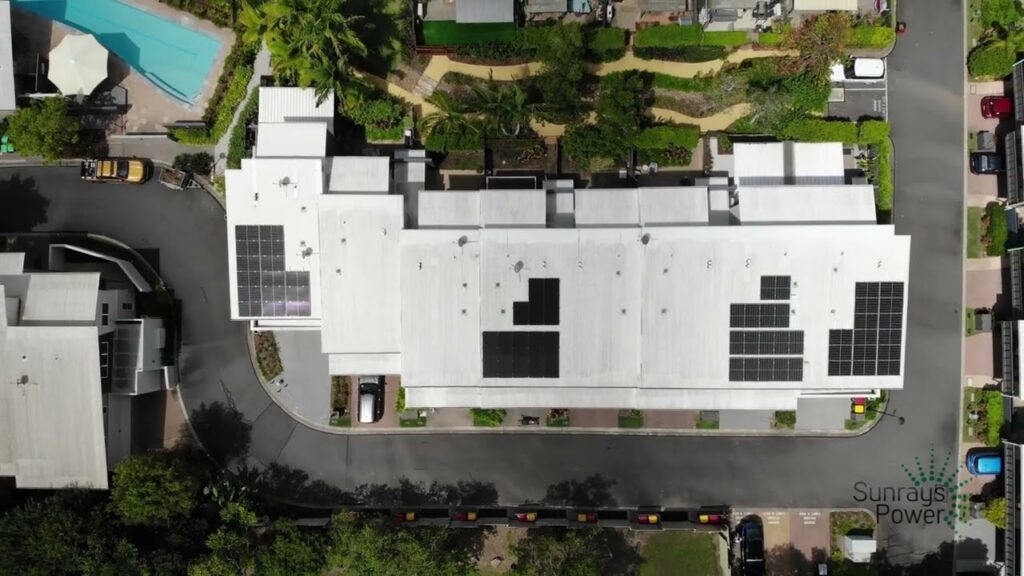 Blog 8 Aerial view of commercial building rooftop with installed solar panels